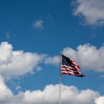 American flag flying over GVSU campus